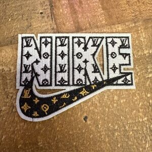 Nike Embroidered Patch with Gold Accents